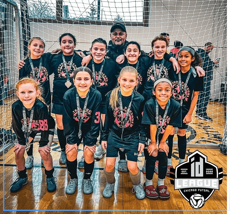 Group 16 (1) Girls' soccer team posing on indoor court.