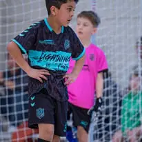 IDLeague06 Boys playing indoor soccer game.